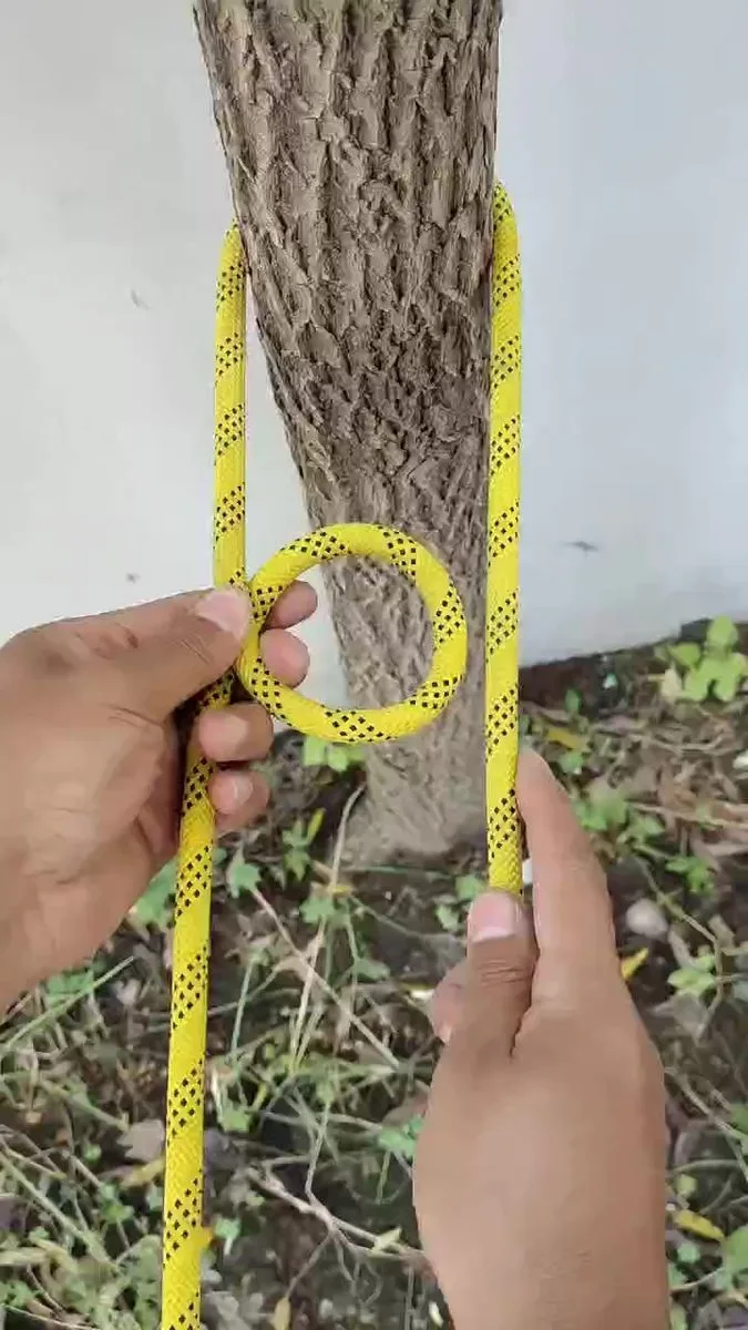 rope knot eyebolt wooden post close-up